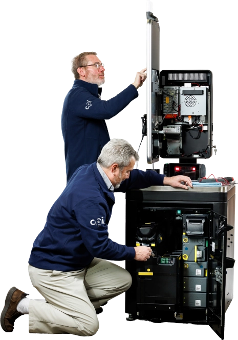 Two engineers repairing a machine